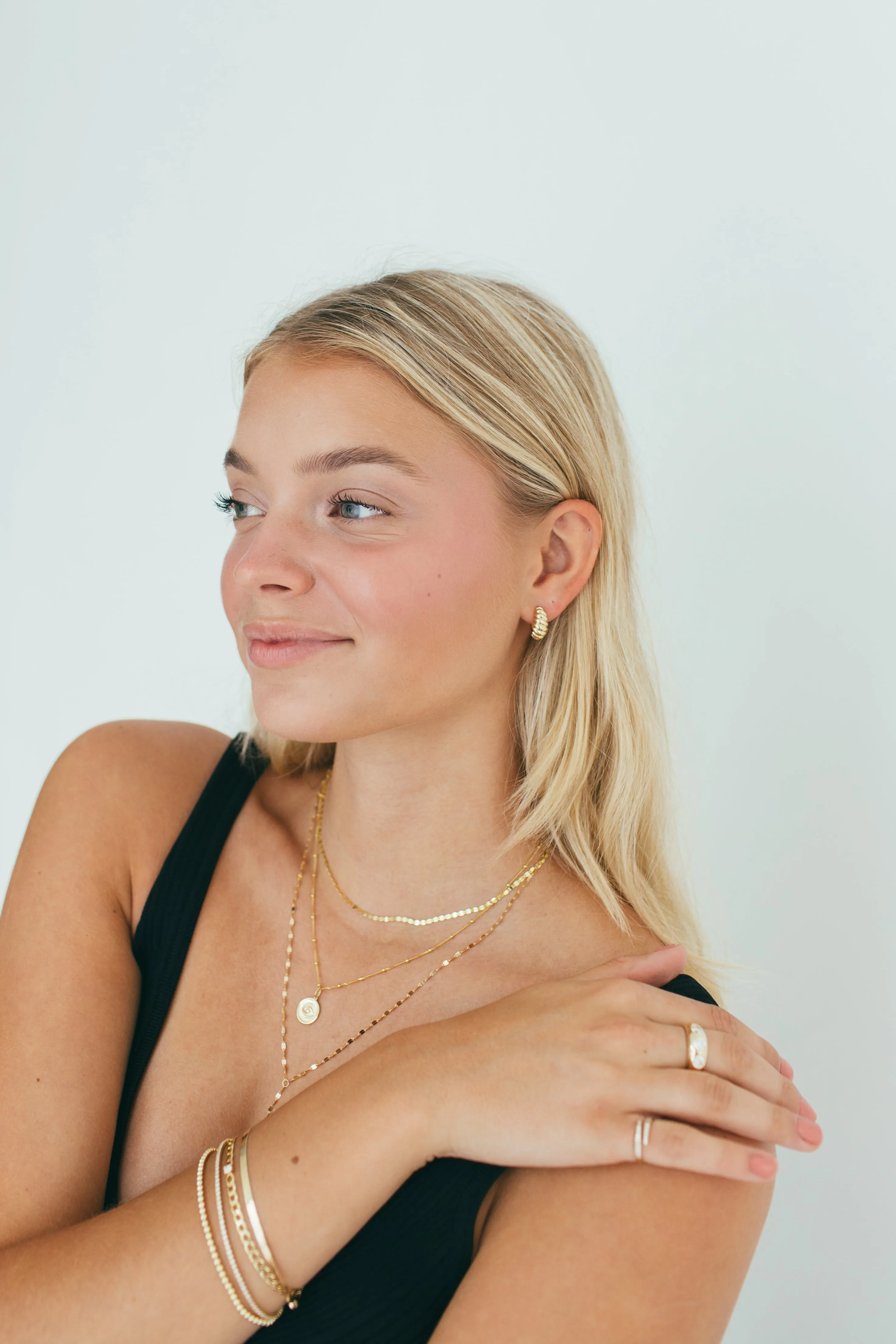 10 Karat Gold Croissant Huggie Earrings