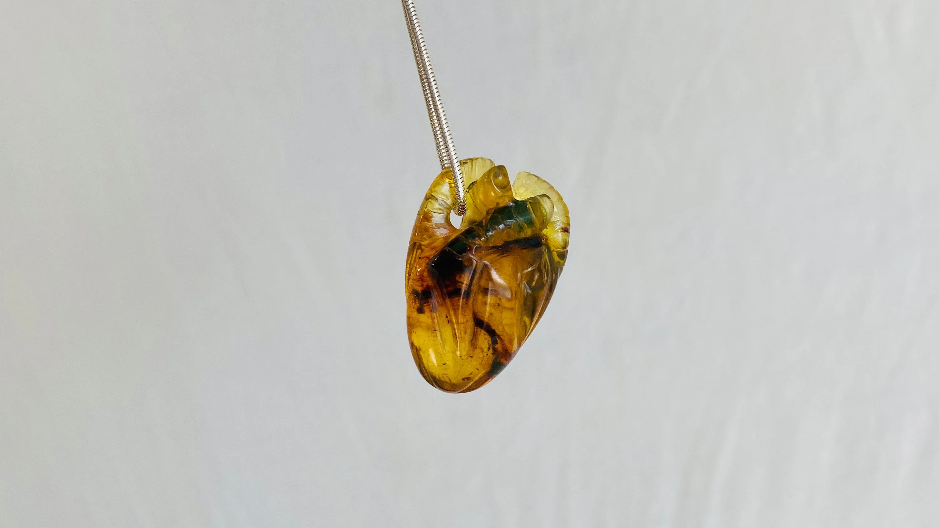 Amber Anatomic Heart Pendant on Sterling Silver Snake Chain. Atelier Aadya